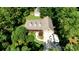 Aerial shot of a home featuring a well-manicured lawn, a detached garage, and multiple vehicles at 260 River Country Rd, Salisbury, NC 28146