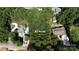 Aerial view showcasing the property's .64 acres, landscaping, and proximity to neighboring homes at 260 River Country Rd, Salisbury, NC 28146