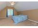 Spacious bedroom featuring a ceiling fan, window with curtains, and neutral wall color at 260 River Country Rd, Salisbury, NC 28146