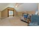 A large bonus room with natural light, carpeted floors, and ample space for storage or recreation at 260 River Country Rd, Salisbury, NC 28146
