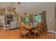 Dining area with hardwood floors, natural light, and open layout to the living room at 260 River Country Rd, Salisbury, NC 28146