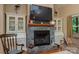 Close-up of the stone fireplace in the living room, flanked by built-in cabinets at 260 River Country Rd, Salisbury, NC 28146