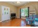 Inviting living room featuring wood floors, a bright window, and comfortable seating area with lots of sunlight at 260 River Country Rd, Salisbury, NC 28146