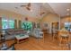 Open-concept living room with hardwood floors, vaulted ceilings, and abundant natural light at 260 River Country Rd, Salisbury, NC 28146