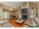 Spacious living room with a stone fireplace, hardwood floors, and natural light at 260 River Country Rd, Salisbury, NC 28146