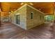 Exterior view showcasing large porch with wood floor and ceilings at 260 River Country Rd, Salisbury, NC 28146