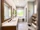 This bathroom has a double vanity, soaker tub, and large frosted window for lots of light and privacy at 4023 Yesteryears Ln, Marshville, NC 28103
