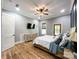 Warm bedroom featuring hardwood floors, natural light, and access to backyard at 4023 Yesteryears Ln, Marshville, NC 28103