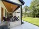 Relaxing covered patio with comfortable seating and an outdoor grill at 4023 Yesteryears Ln, Marshville, NC 28103