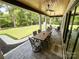 Covered patio with ceiling fans, stone flooring, and an outdoor dining table at 4023 Yesteryears Ln, Marshville, NC 28103