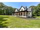 Beautiful home with covered front porch, lush lawn, and impeccable landscaping at 4023 Yesteryears Ln, Marshville, NC 28103