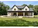 Stunning two-story home with a welcoming front porch and well-manicured lawn at 4023 Yesteryears Ln, Marshville, NC 28103