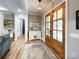 Elegant foyer with a decorative rug, wood floors, and a view of the front doors at 4023 Yesteryears Ln, Marshville, NC 28103