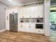 Modern kitchen features ample white cabinets, stainless steel appliances, and sleek countertops at 4023 Yesteryears Ln, Marshville, NC 28103