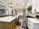 Open kitchen view with stainless steel appliances, central island, and view to dining room at 4023 Yesteryears Ln, Marshville, NC 28103