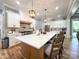 Bright kitchen with white cabinets, stainless appliances, and spacious center island at 4023 Yesteryears Ln, Marshville, NC 28103