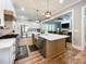 Spacious kitchen with stainless steel appliances, large island, and open view to living room at 4023 Yesteryears Ln, Marshville, NC 28103
