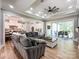 Open concept living room with hardwood floors, leading to the kitchen and patio at 4023 Yesteryears Ln, Marshville, NC 28103