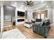 Bright living room with fireplace, recessed lighting, ceiling fan and beautiful hardwood floors at 4023 Yesteryears Ln, Marshville, NC 28103
