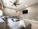 This living room features a large sectional sofa, neutral paint, a ceiling fan, and a wall-mounted television at 4023 Yesteryears Ln, Marshville, NC 28103