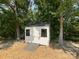 White storage shed with double doors, providing ample outdoor storage at 4023 Yesteryears Ln, Marshville, NC 28103