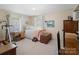 Bedroom with a bed, desk, and an exercise machine next to the window at 409 E 18Th St, Kannapolis, NC 28083