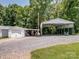 Detached garage and carport with a large gravel parking area at 409 E 18Th St, Kannapolis, NC 28083