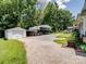 View of the detached one car garage and separate three car carport at 409 E 18Th St, Kannapolis, NC 28083