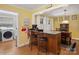 Open kitchen area with an island and bar seating, adjacent to the laundry room at 409 E 18Th St, Kannapolis, NC 28083
