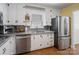 View of the kitchen, showcasing stainless steel appliances, granite counters, and white cabinets at 409 E 18Th St, Kannapolis, NC 28083