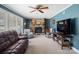 Comfortable living room with a brick fireplace, built-in shelving, and plush seating at 409 E 18Th St, Kannapolis, NC 28083