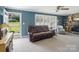 Cozy living room featuring a brick fireplace, plush seating, and an inviting atmosphere at 409 E 18Th St, Kannapolis, NC 28083