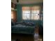 Bedroom with hardwood floors, blue walls and natural light at 410 Arthur Ave, Gastonia, NC 28052