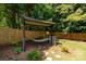 Tranquil backyard spot with a hammock under a covered structure next to a wood fence at 4567 Hickory Grove Rd, Sharon, SC 29742