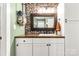 Stylish bathroom featuring a stone backsplash, modern vanity with storage, and elegant fixtures at 4567 Hickory Grove Rd, Sharon, SC 29742