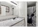 Well-lit bathroom featuring a granite countertop and shower with custom shower curtain at 4567 Hickory Grove Rd, Sharon, SC 29742
