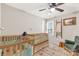 Neutral-toned bedroom featuring twin beds, a cozy chair, and a decorative ladder at 4567 Hickory Grove Rd, Sharon, SC 29742