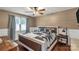 Cozy bedroom with a ceiling fan, and a large window, offering natural light and comfortable living space at 4567 Hickory Grove Rd, Sharon, SC 29742