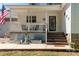 Inviting front porch with decorative elements and space for seating at 4567 Hickory Grove Rd, Sharon, SC 29742