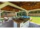Outdoor gazebo with a grill, seating, and view of a pool, great for entertaining at 4567 Hickory Grove Rd, Sharon, SC 29742
