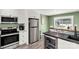 Modern kitchen with stainless steel appliances, granite countertops, and an inviting eat-in bar area at 4567 Hickory Grove Rd, Sharon, SC 29742