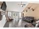 Bright living room with high ceilings, a leather sofa, and French doors leading to the backyard at 4567 Hickory Grove Rd, Sharon, SC 29742