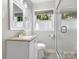 Clean bathroom featuring a modern sink, toilet, and glass door shower at 4618 Emory Ln, Charlotte, NC 28211