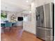 Dining area features modern decor, hardwood floors, and stainless refrigerator at 4618 Emory Ln, Charlotte, NC 28211