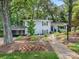 Charming two-story home with a lush, landscaped front yard and inviting walkway at 4618 Emory Ln, Charlotte, NC 28211