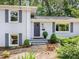 Charming brick home featuring a stylish front door and well-maintained landscaping at 4618 Emory Ln, Charlotte, NC 28211