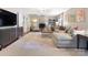 Open living room featuring hardwood floors, a fireplace, a sofa, and a stylish coffee table at 4618 Emory Ln, Charlotte, NC 28211