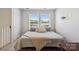 Bedroom with several windows, neutral tones, and natural light at 5008 Calvine Mill Way, Charlotte, NC 28205