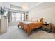 Bright and airy bedroom featuring a neutral color scheme, large window, and a comfortable-looking bed at 5008 Calvine Mill Way, Charlotte, NC 28205