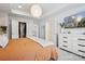 Cozy bedroom with ample natural light, a modern dresser, and a view into the walk-in closet at 5008 Calvine Mill Way, Charlotte, NC 28205